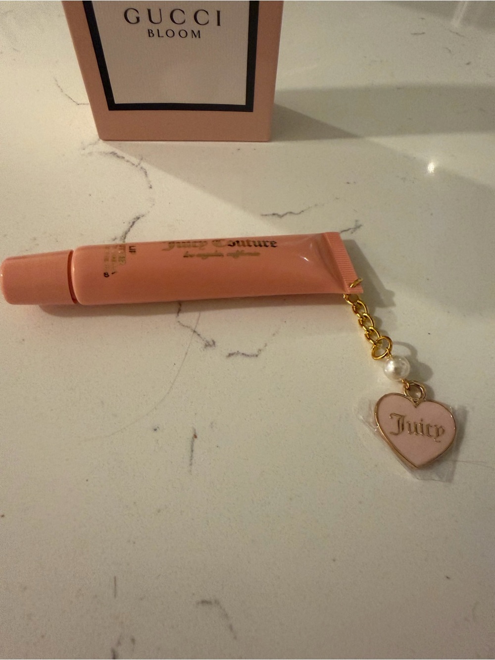 Juicy Couture Peach-Pink Lip Gloss Tube with Gold Heart Charm